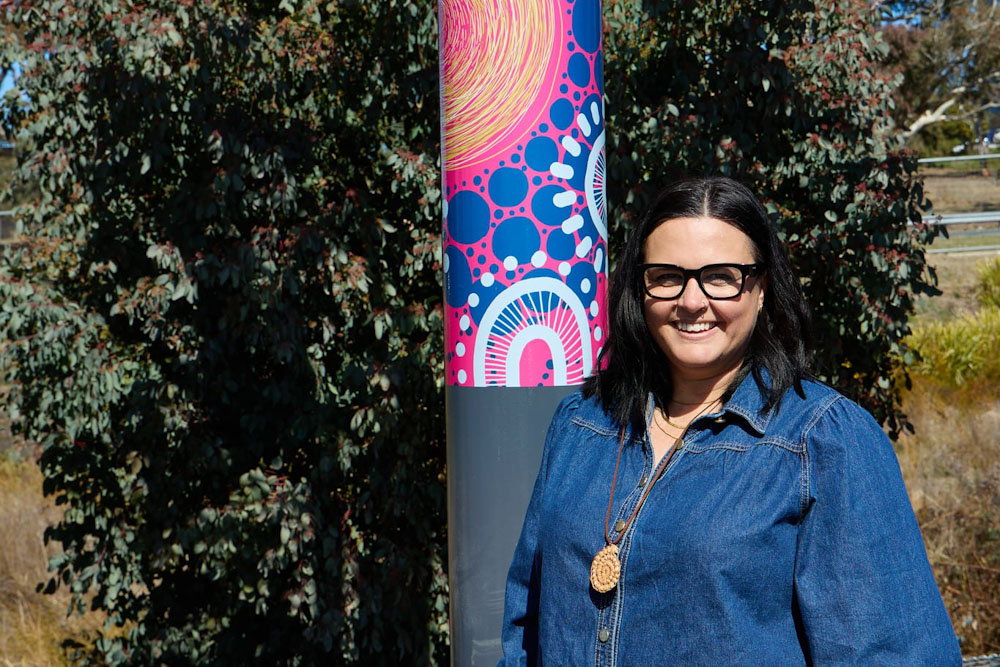 Image of artist with artwork